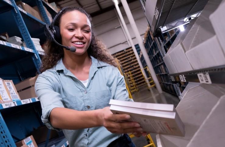 Warehouse worker using voice control headset